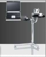 Imagen de una mesa ergonómica con varios brazos que sujetan un ordenador, una agenda y una taza de café.